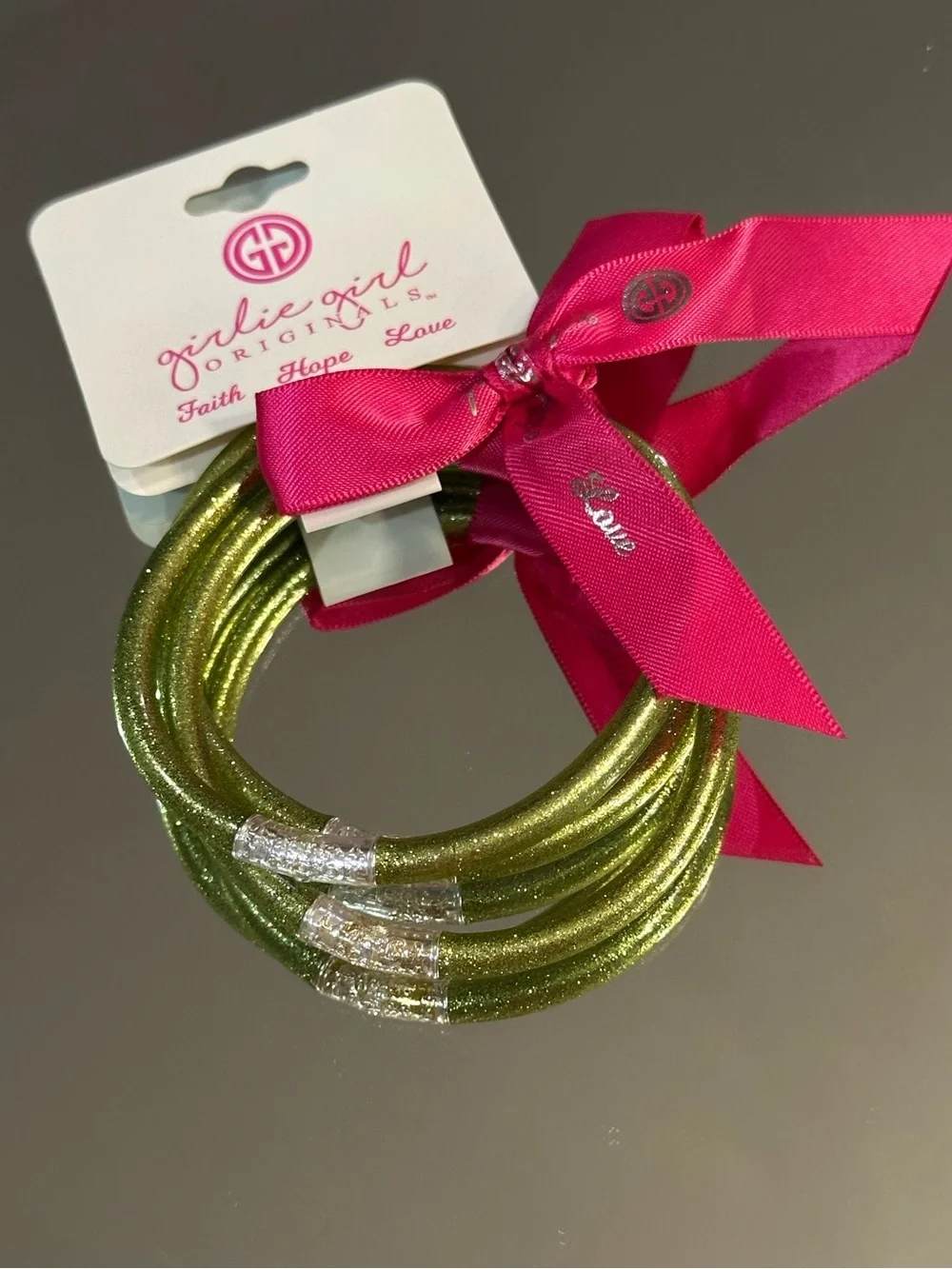 Girlie Girl Originals. 3 Glittery Green Bracelets with Pink Ribbon. (NWT)